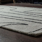 Abbey Valetta rectangular handwoven wool area rug with abstract design in neutral tones, enhancing modern interiors.