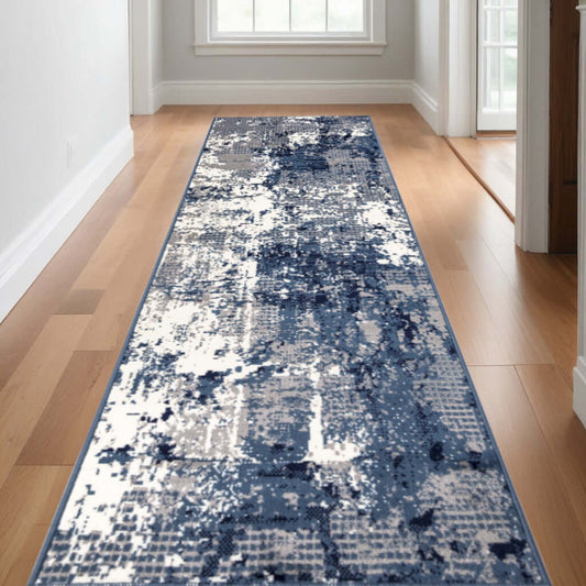 Blue Abstract Power Loom Runner Rug in modern hallway setting, showcasing vibrant blue and white pattern.