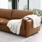 Brighton Top Grain Leather Modular Sofa in rich brown with a cozy white knitted throw blanket.