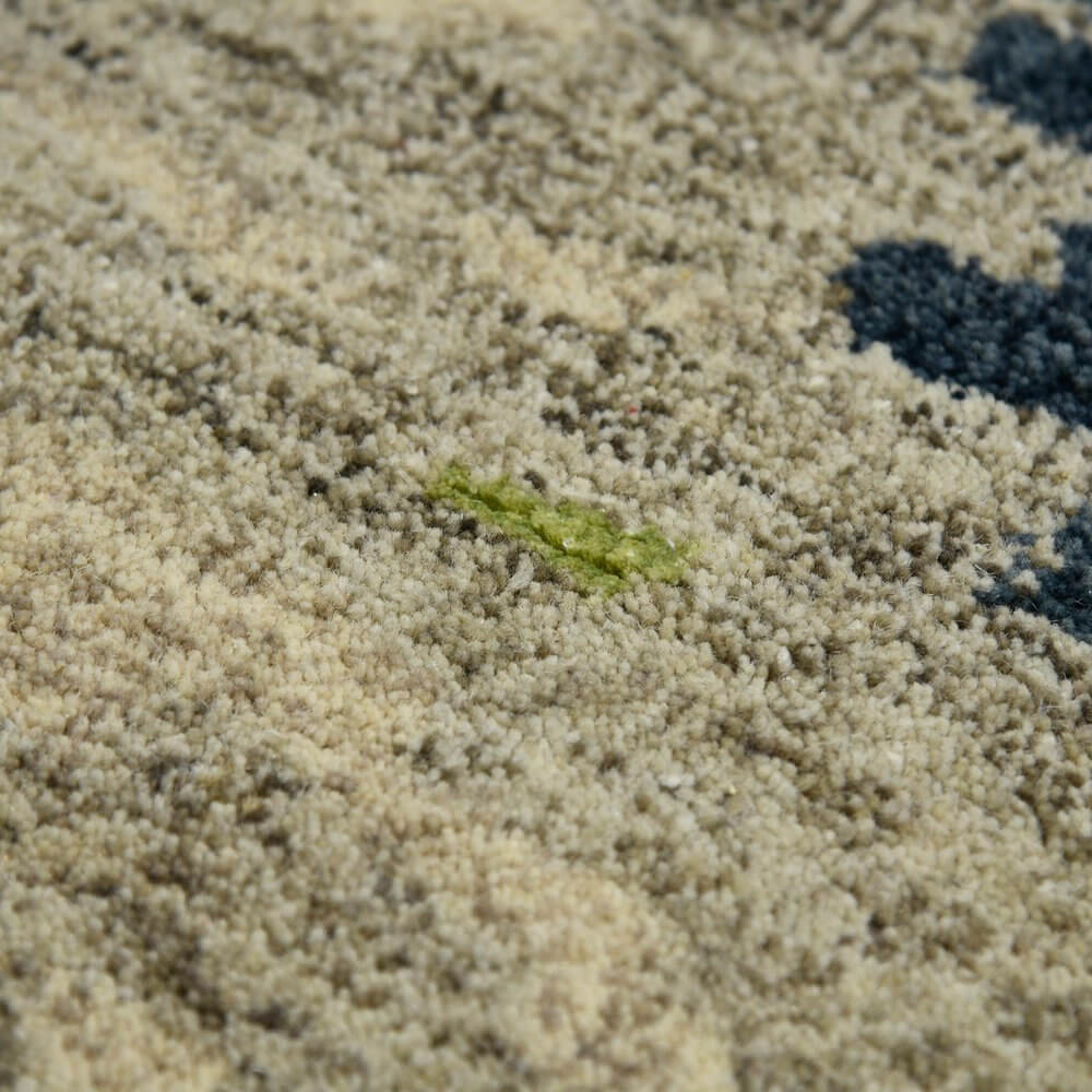 Close-up of Sand And Green Wool Abstract Hand Tufted Area Rug | 9' x 13' showcasing texture and design elements.