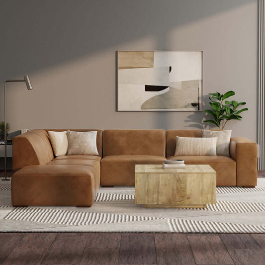 Rex Top-Grain Leather Modular Corner Sectional Sofa with Ottoman in caramel color, modern living room setting, and stylish decor.