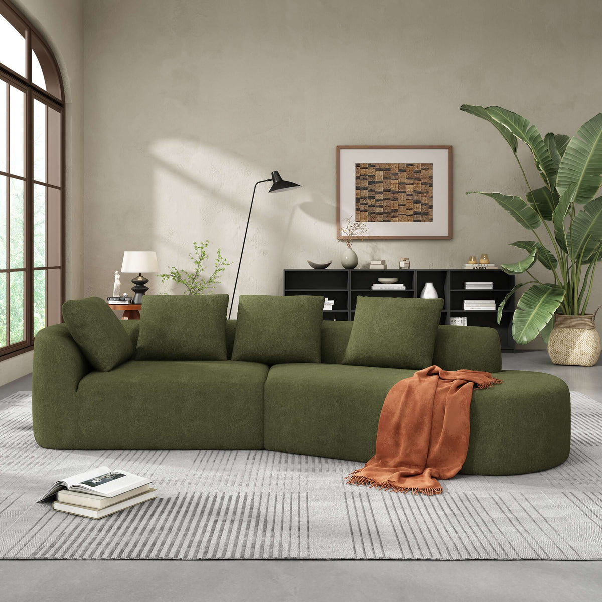Modern Low Profile Modular Curved Foam Sofa 116' (4 Colors) in green upholstery with cushions in a stylish indoor setting.