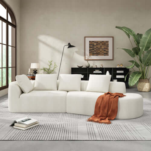 Modern Low Profile Modular Curved Foam Sofa 116' (4 Colors) in a stylish living room with a modern aesthetic.
