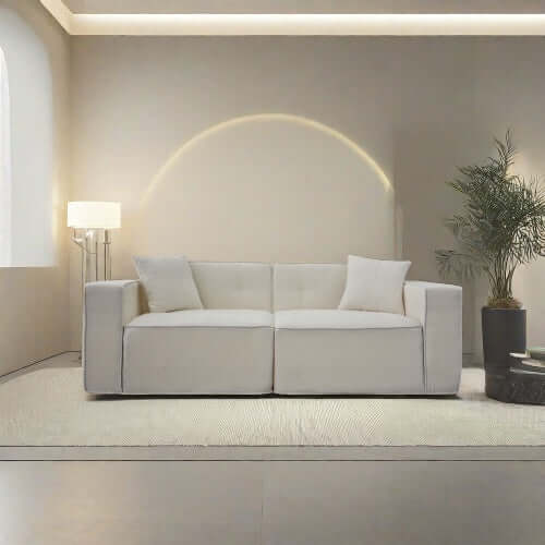 Modern low profile box arm memory foam sofa in a stylish living room setting.