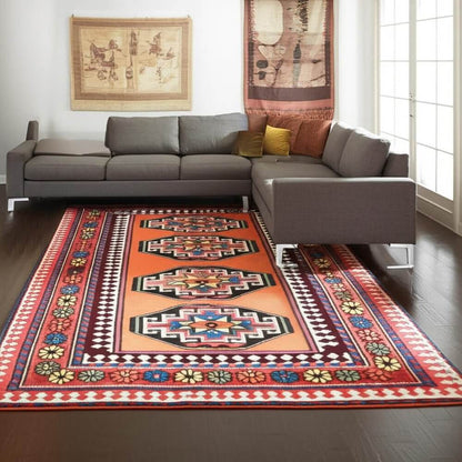 Red And Orange Tribal Washable Area Rug With UV Protection Area Rug | 9' x 13' displayed in a modern living room.