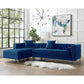Navy Blue Velvet Rectangular Sofa and Chaise Sectional And Toss Pillows in modern living room setting.