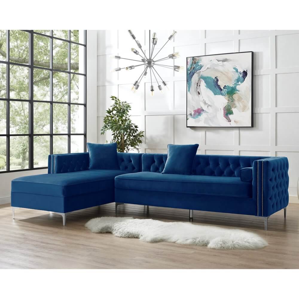 Navy Blue Velvet Rectangular Sofa and Chaise Sectional And Toss Pillows in modern living room setting.