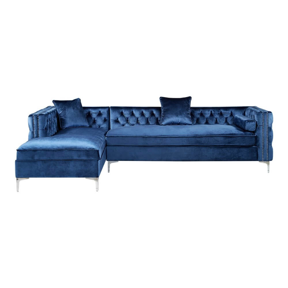 Navy Blue Velvet Rectangular Sofa and Chaise Sectional And Toss Pillows with nailhead trim and silver metal legs.