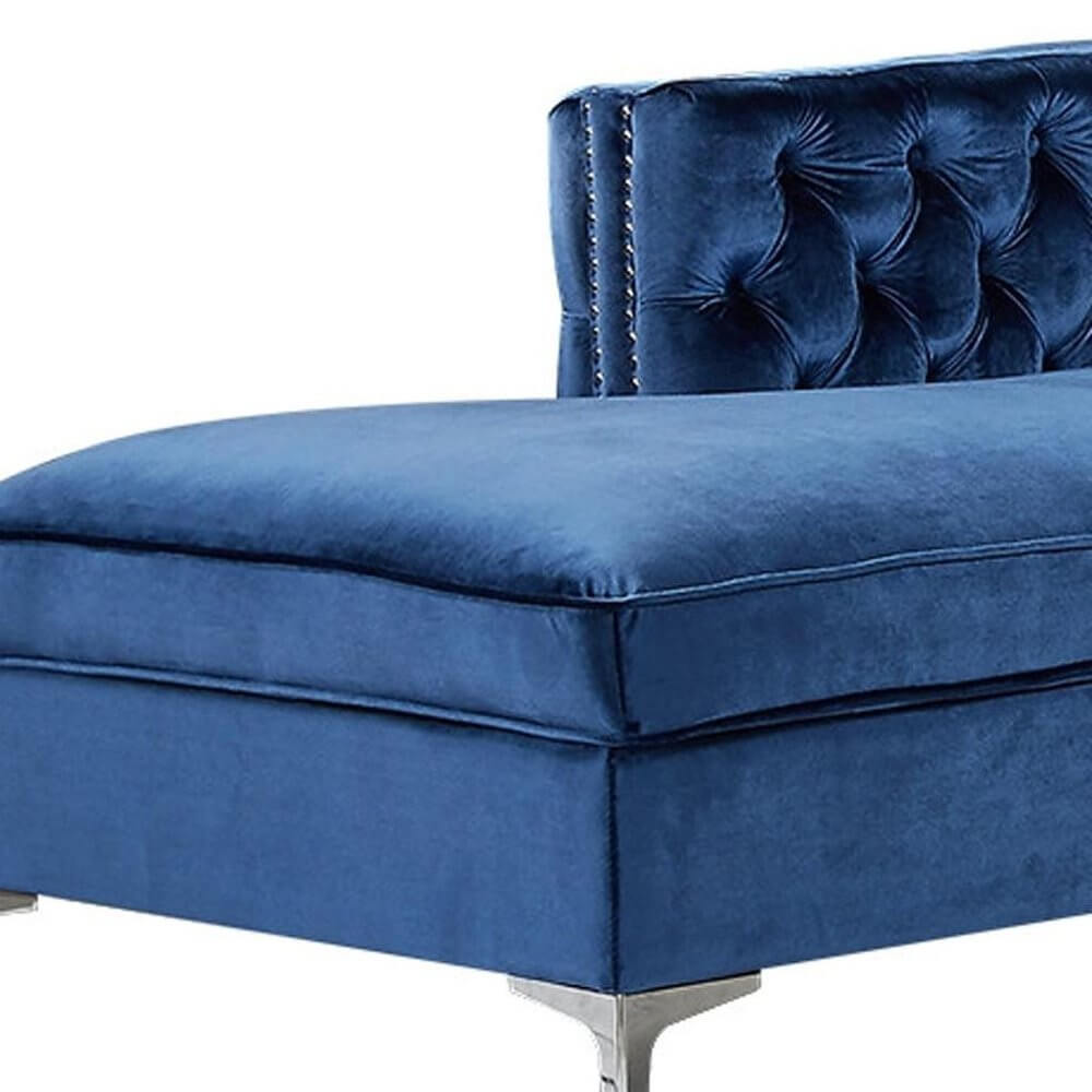 Navy Blue Velvet Rectangular Sofa and Chaise Sectional And Toss Pillows with tufted back and nailhead trim.