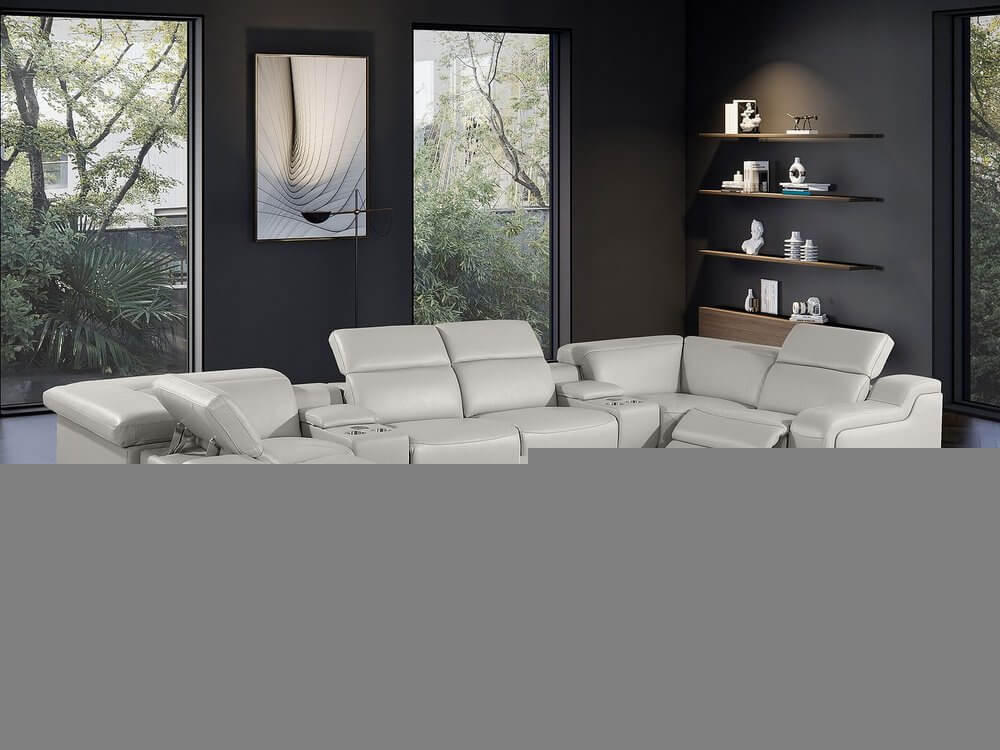 Light Gray Italian Leather Power Reclining U Shaped Eight Piece Corner Sectional With Console in a modern living room.