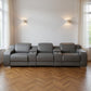 129" White Italian Leather Reclining USB Sofa in a bright living room with large windows and modern lighting