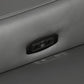 Reclining mechanism and USB port on a gray leather sofa, showcasing modern convenience.