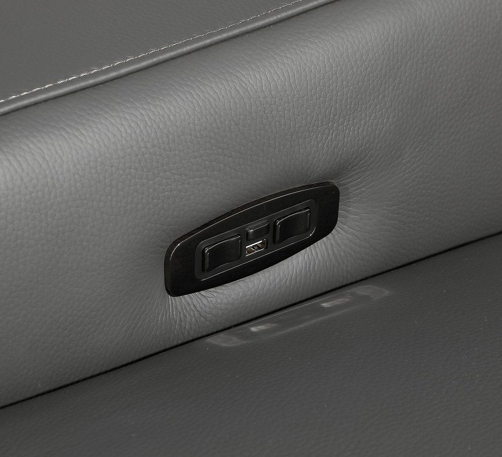 Reclining mechanism and USB port on a gray leather sofa, showcasing modern convenience.