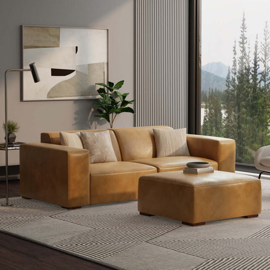 Modern living room with Rex genuine leather sofa and square ottoman, showcasing versatile luxury and stylish design.