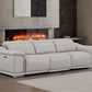 107" Light Gray Top Grain Leather Reclining USB Sofa in a modern living room setting with a cozy fireplace.