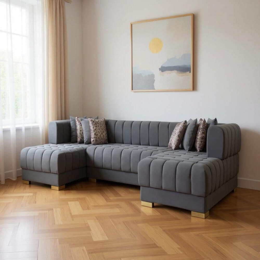 Gray Velvet U Shaped Three Piece Sofa and Chaise Sectional With Toss Pillows in a modern living room setting.