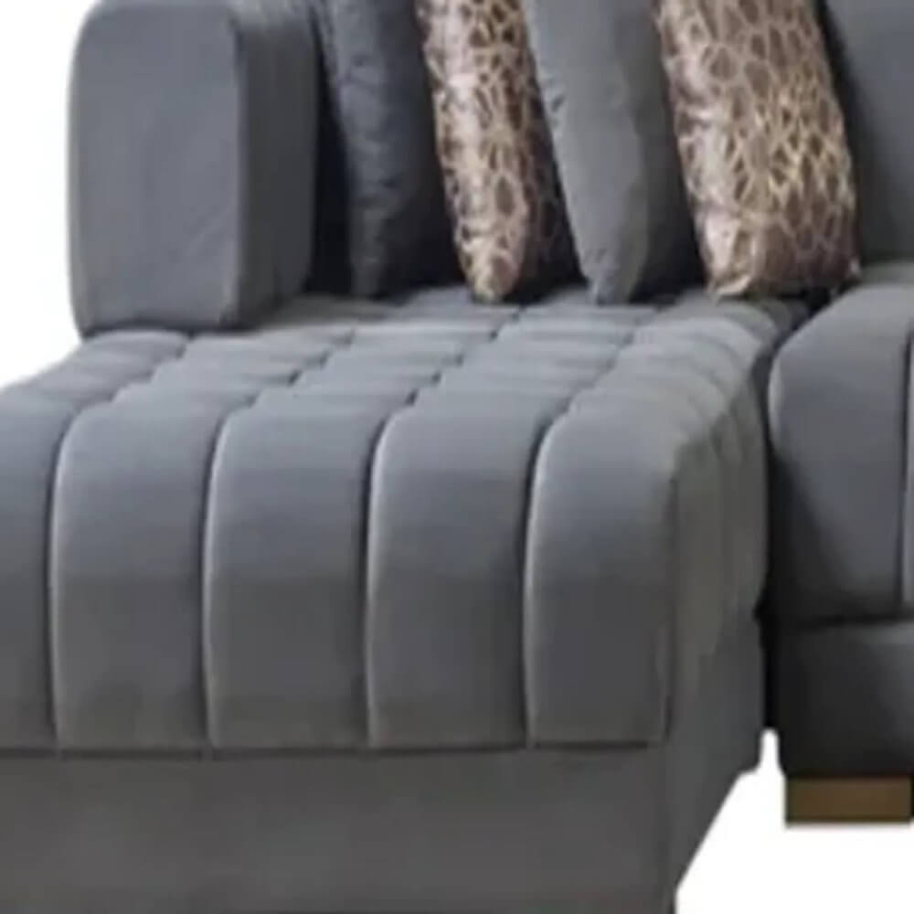 Gray Velvet U Shaped Three Piece Sofa and Chaise Sectional With Toss Pillows corner view featuring plush fabric and decorative pillows.
