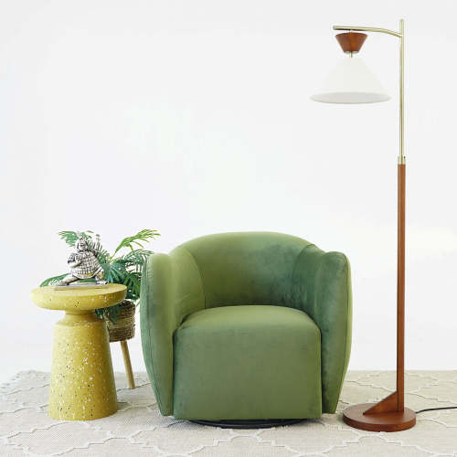 Swivel Lounge Chair in Green Velvet – Renee Modern Barrel Accent Chair with a stylish side table and lamp.