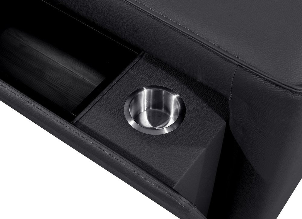 Detail of a cup holder on the 130" Black Top Grain Leather Reclining Metal USB Sofa, showcasing sleek design and functionality.