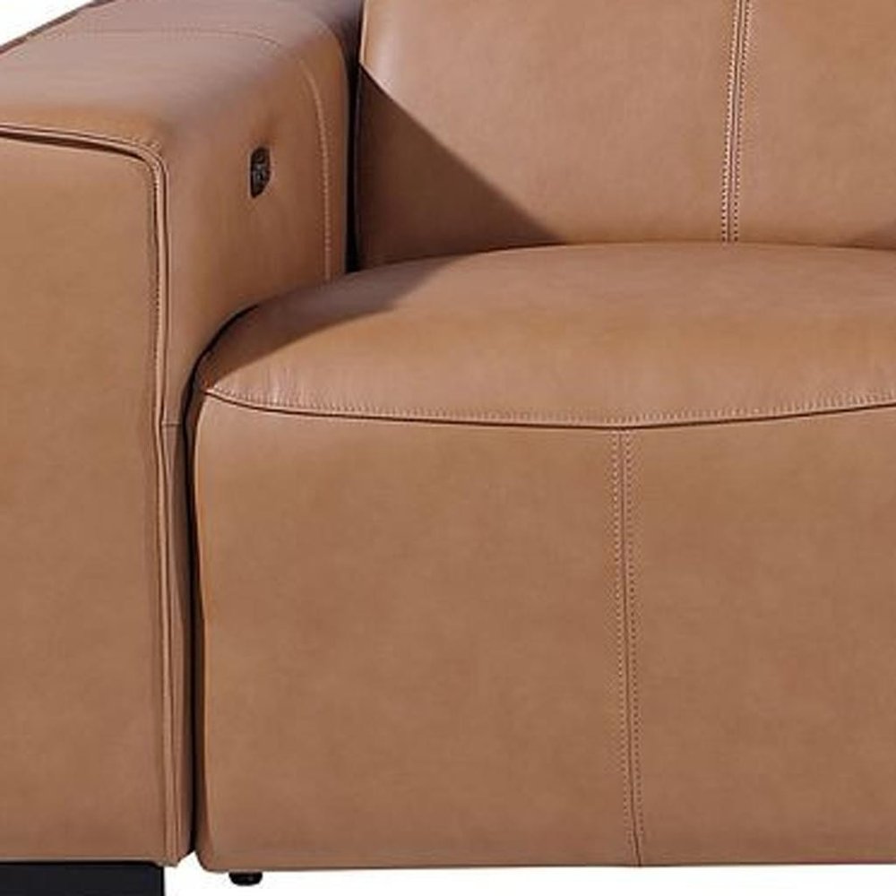 Detail of 130" Black Top Grain Leather Reclining Metal USB Sofa armrest and cushions in premium tan leather.