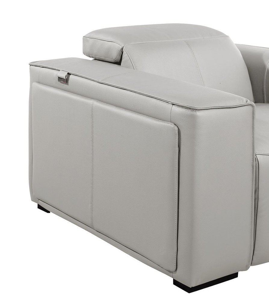 Image of a sleek gray leather sofa side view, highlighting its modern design and premium materials.