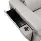 Inside view of the 130" Black Top Grain Leather Reclining Metal USB Sofa's storage compartment and cup holder.