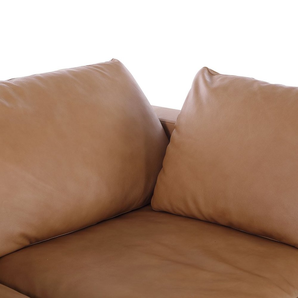 Close-up of cushions on the 122" Beige Top Grain Leather Reclining Solid Wood Sofa.