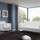 80" White Faux Leather Sleeper Sofa With Silver Legs in modern living room setting with decorative art.