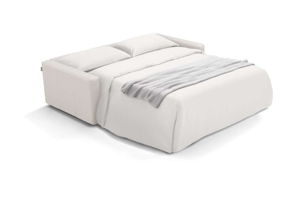 81" White Leather Sleeper Sofa in an open position with a light grey throw blanket.
