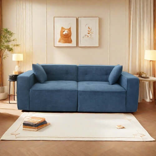 Modern low profile blue box arm memory foam sofa with cushions in a stylish living room setting.