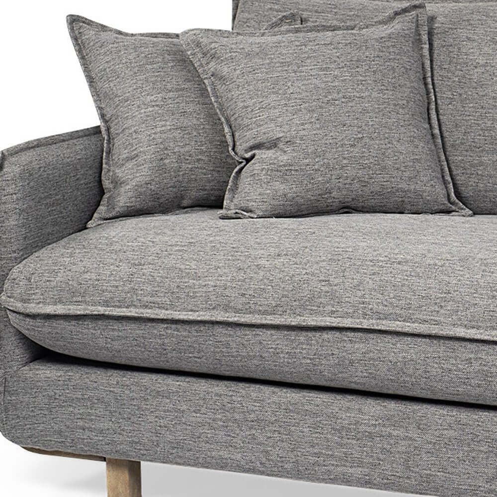 Close-up view of 84" Gray Fabric Sofa With Brown Legs, showcasing soft cushions and modern design.