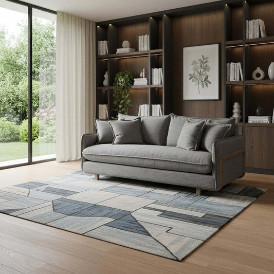 84" Gray Fabric Sofa With Brown Legs in a stylish living room setting with modern decor and a patterned rug.