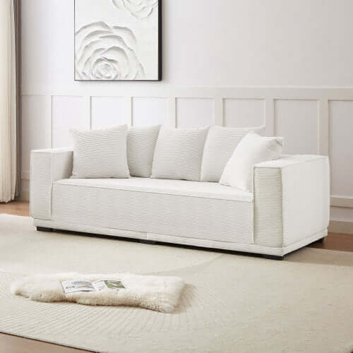 MCM Box Arm Corduroy Upholstered Sofa 89" in white with plush pillows, showcasing mid-century design and cozy comfort.