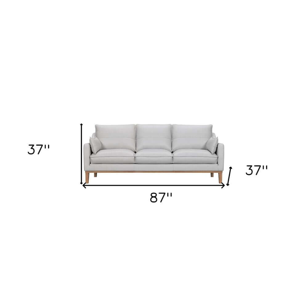 87" Gray Leather Sofa And Toss Pillows With Brown Legs dimensions shown in image with measurements.