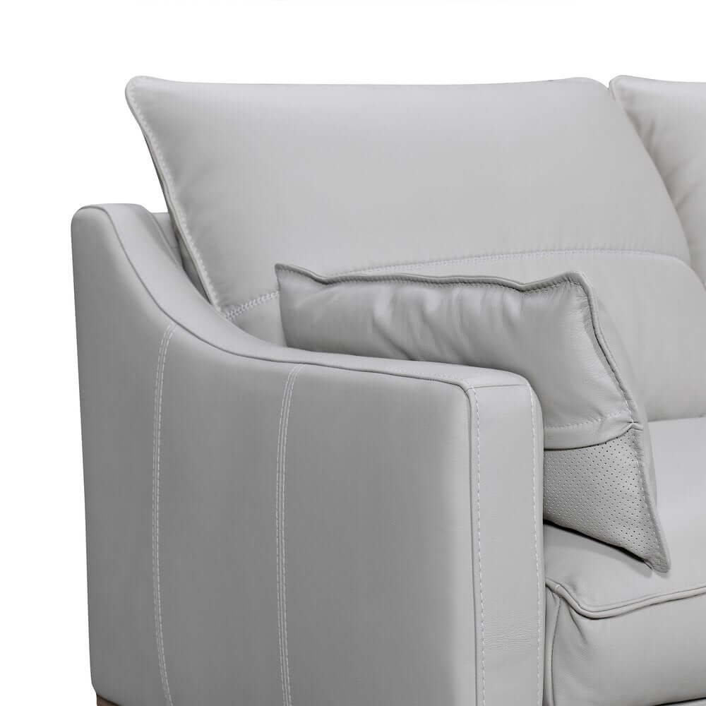 87" Gray Leather Sofa And Toss Pillows With Brown Legs showing soft leather and cozy cushions.