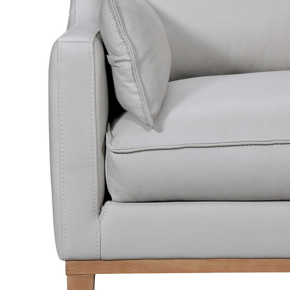 87" Gray Leather Sofa And Toss Pillows With Brown Legs side view showcasing soft leather and modern design