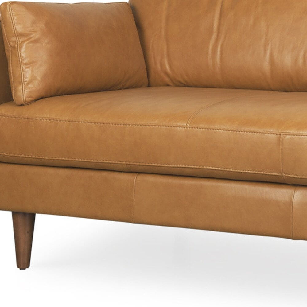 88" Tan Leather Sofa And Toss Pillows With Brown Legs showcasing supple leather and elegant design.