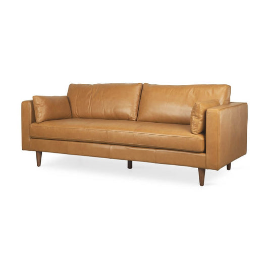 88" Tan Leather Sofa And Toss Pillows With Brown Legs - Elegantly designed for comfort and style.