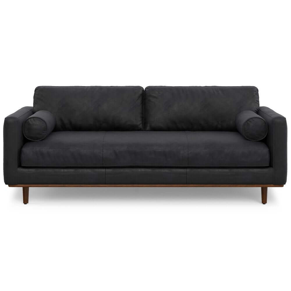 89" Black Leather Sofa With Brown Legs featuring a streamlined design and plush cushions for comfort.
