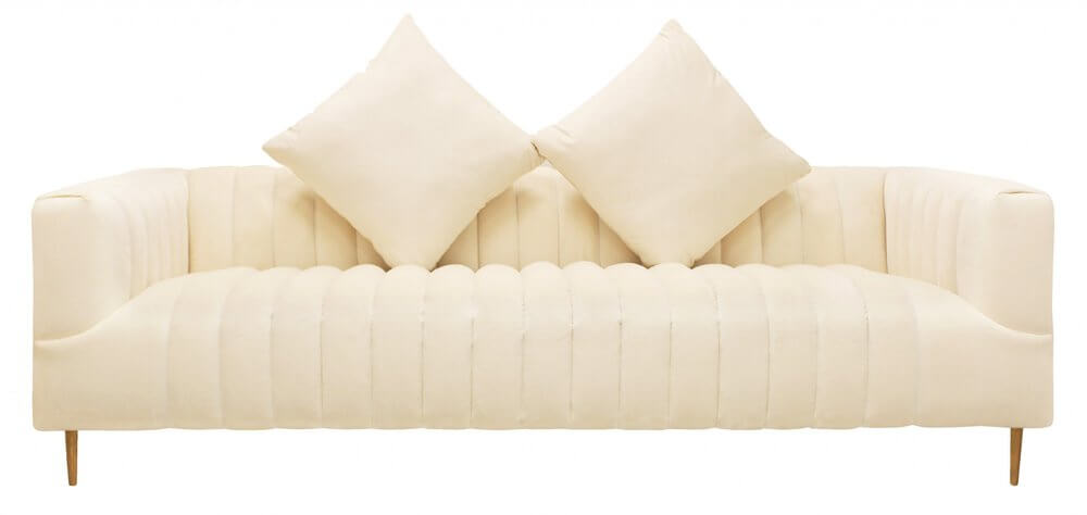 90" Ivory Velvet Sofa And Toss Pillows With Gold Legs in a luxurious design featuring soft upholstery and stylish gold legs.