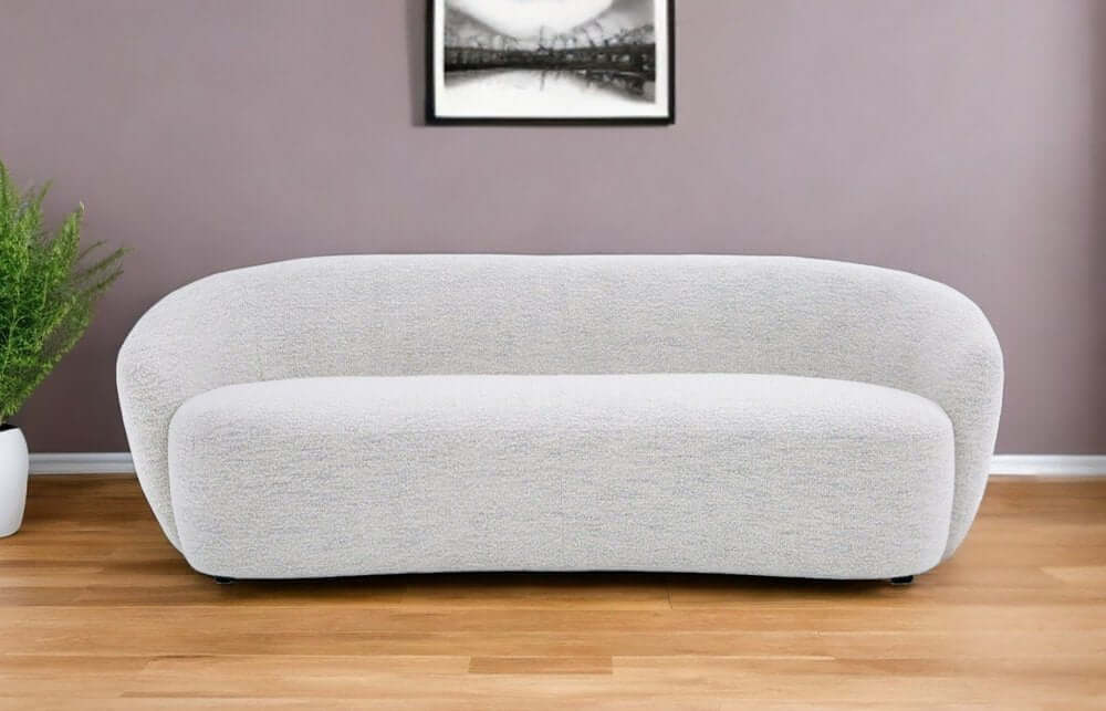 90" Off White Fabric Sofa With Black Legs in a contemporary living room setting.