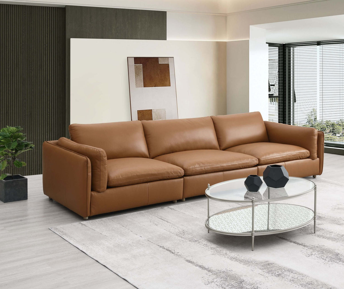 Brighton Top Grain Leather Low Profile Modular Sofa in a modern living room setting with a glass coffee table.