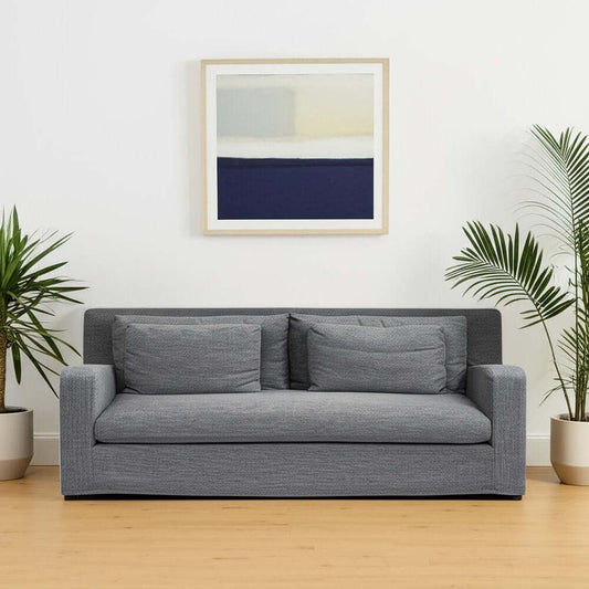 93" Dark Gray Slipcovered Fabric Sofa with Toss Pillows | Modern Upholstered Couch in a contemporary living room setting.
