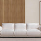 98" White Velvet Sofa in a modern living room setting with wood panel wall and framed artwork.