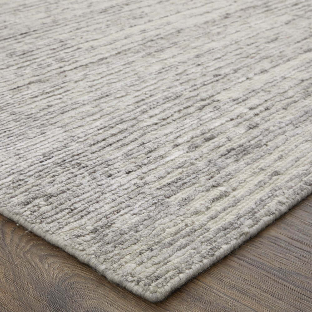 9' X 13' Ivory And Gray Abstract Hand Knotted Distressed Area Rug close-up, showcasing texture and design.