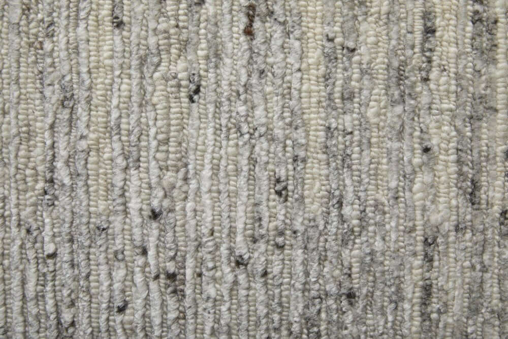 Close-up texture of 9' X 13' Ivory and Gray Abstract Hand Knotted Worn Faded Area Rug, showcasing intricate patterns.