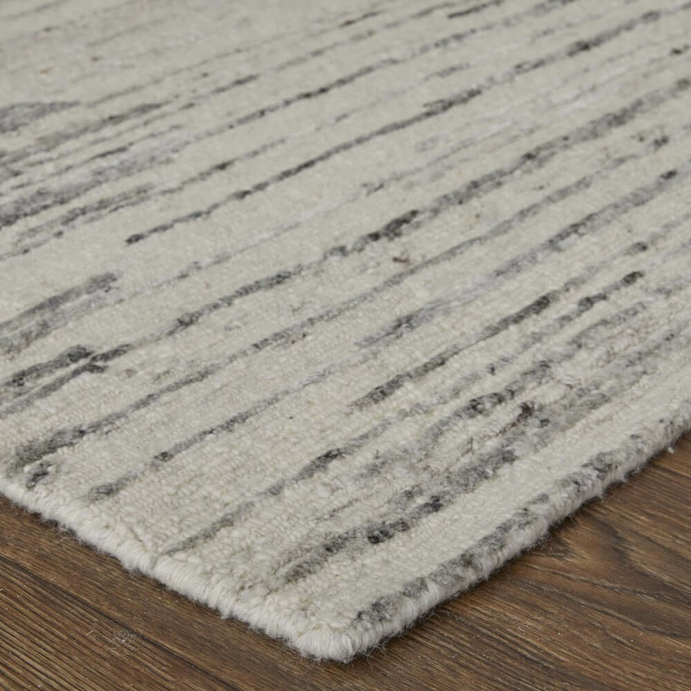 9' X 13' Ivory and Gray Abstract Hand Knotted Worn Faded Area Rug with intricate design details on a wooden floor.