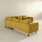 The Amber MCM Corner Sectional Sofa 103 by Ashcroft Furniture, shown in yellow, features clean lines and wooden legs. It’s placed in a bright, minimalist room with light walls and floors, highlighting its premium craftsmanship.