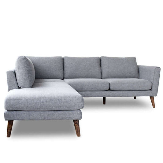 The Benson Fabric L Shape Sectional Chaise Sofa 97 by Ashcroft Furniture Co. features light gray upholstery and angled wooden legs, displayed on a white background.