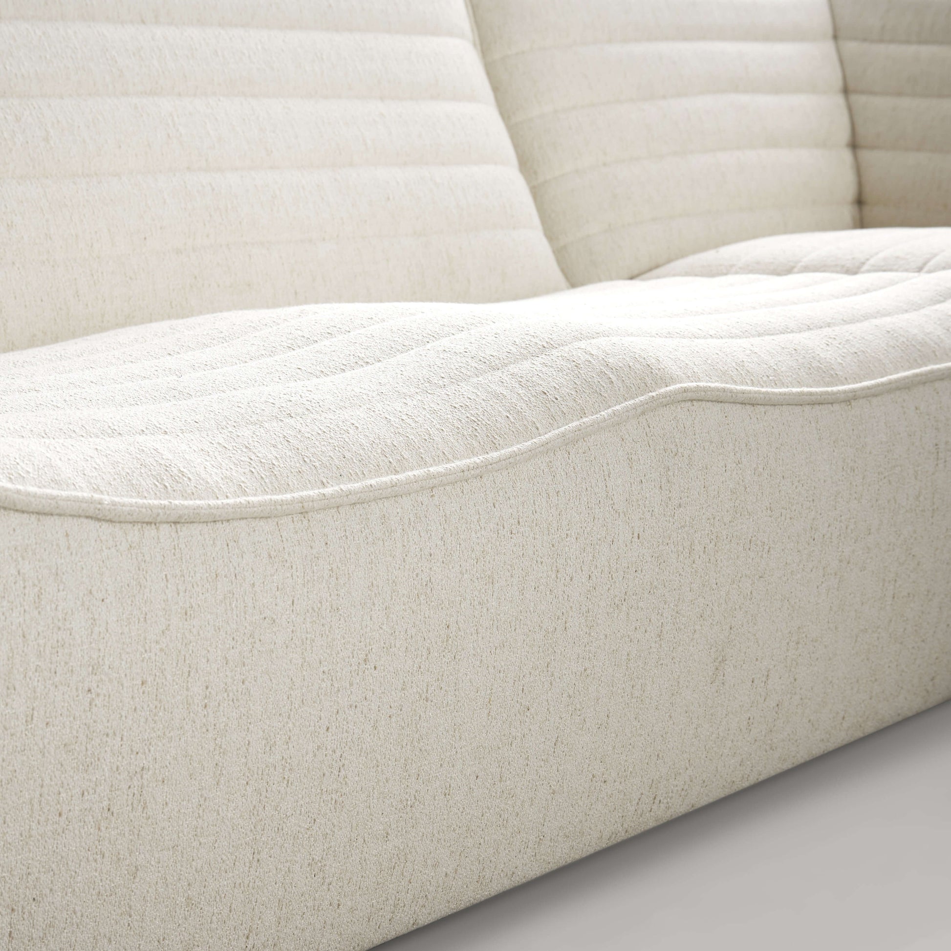 Close-up of the Evelyn Harmony Fabric Corner Sofa Sectional showcasing its soft, textured upholstery and ergonomic design.